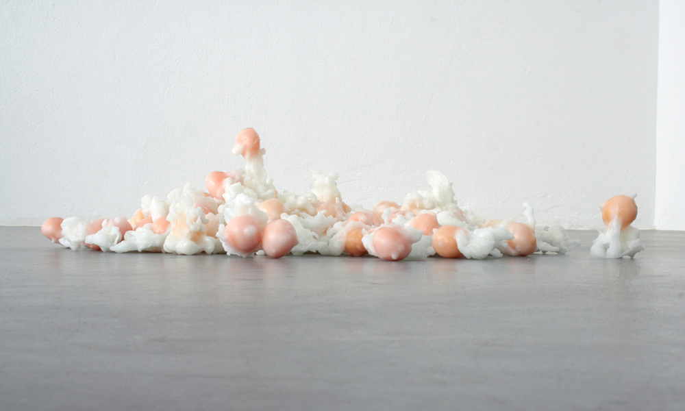 installation by Mair Hughes consisting of 50 egg yolks coated in wax